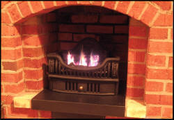 Gas Coal Basket in small brick fireplace